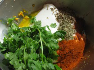 yogurt, tumeric, garlic, ginger, cilantro, cumin, thyme, chilies