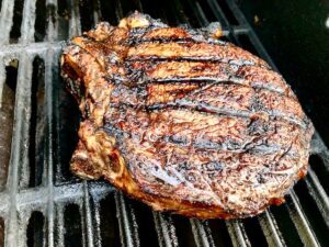 Bone in Ribeye on grill with sear marks