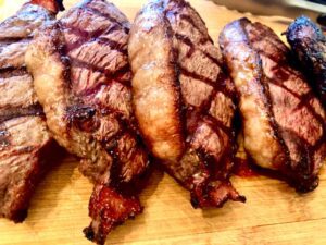 Sirloin Coulotte with Sear Marks sliced on a cutting board