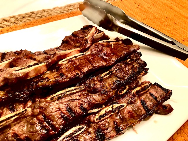 Beef Short Ribs on Plate with tongs