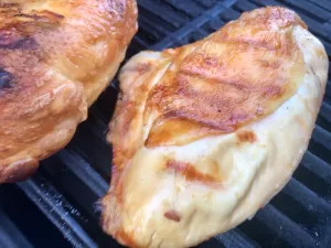 Grilled Bone In Chicken Breast on the grill grates