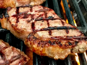 NY Strip Steak with Sear Marks on a hot grill