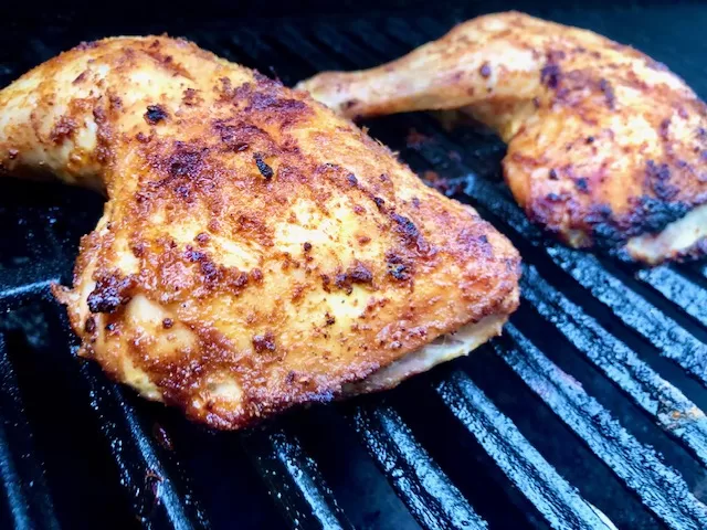 Chicken leg quarters on the grill