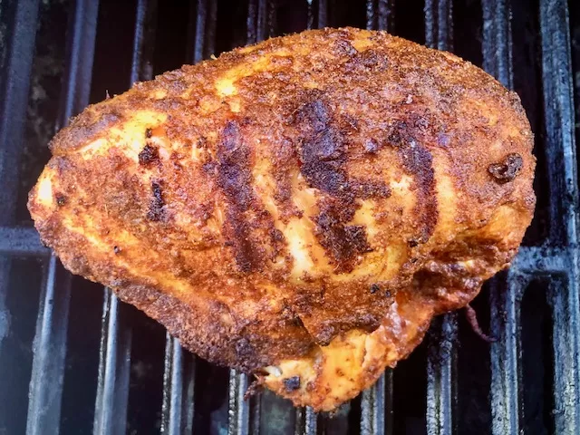 Tandoori Grilled Split Chicken Breast sitting on grill grates
