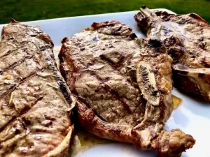 Grilled Steaks topped with Garlic Butter