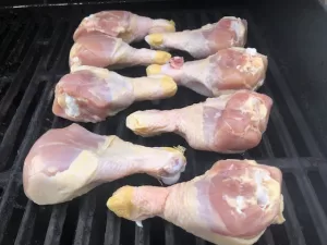 Chicken Legs laying on grill grates