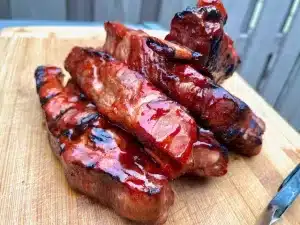 Grilled Pork Ribs with Ah So Sauce sitting on a cutting board