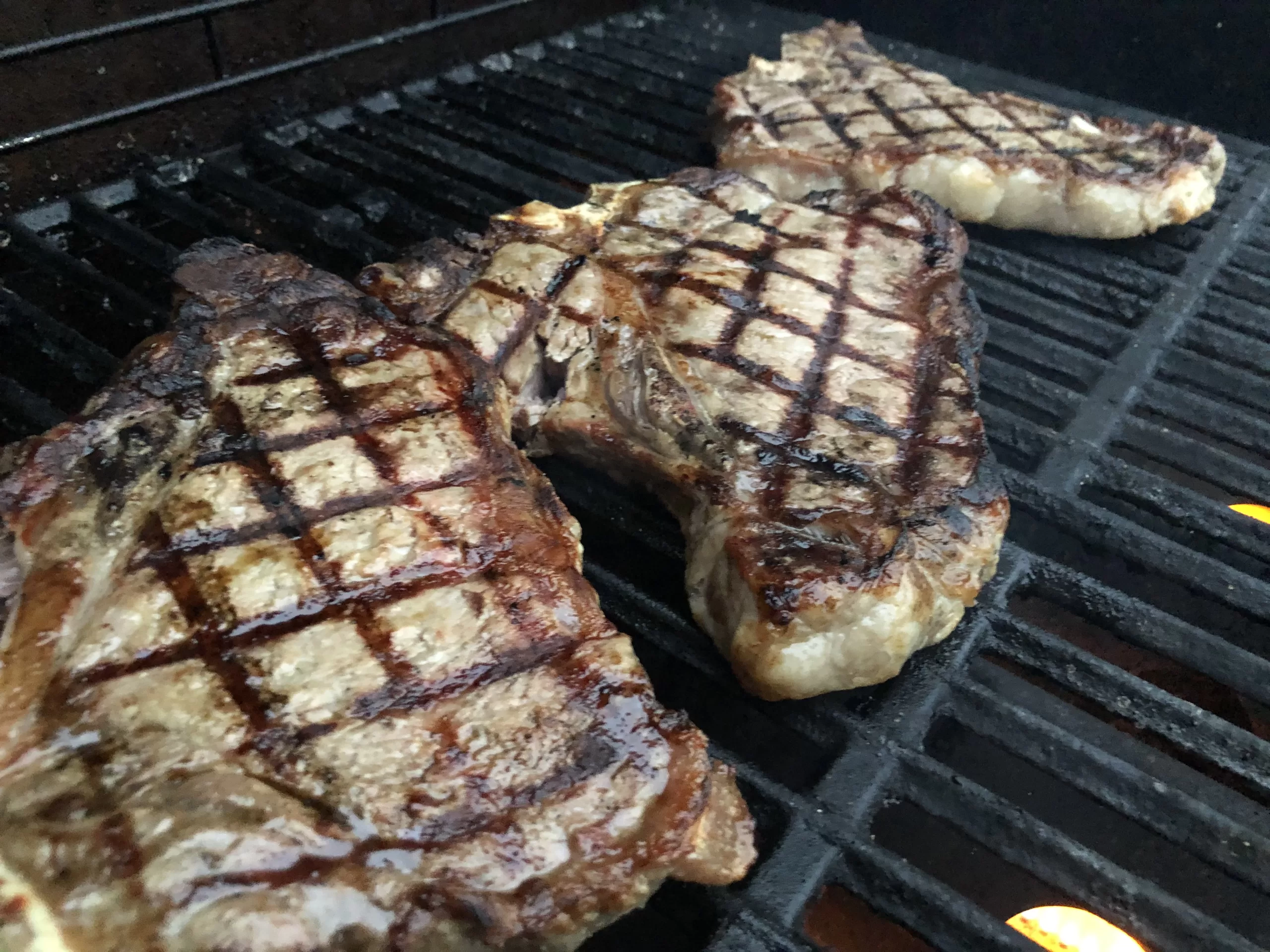 Steaks on the grill at night