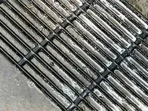 Grill grates being cleaned with Dawn soap