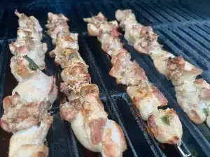 basil chicken kebabs on grill grates