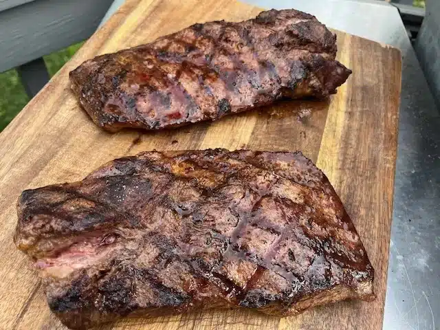 Grilled Flat Iron Steaks with searmarks on cutting board